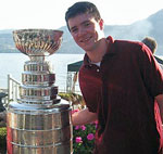 Brendan Burke with the Stanley Cup won by his dad's Anaheim Ducks in 2007.