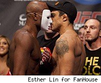Anderson Silva wears a mask when he stares down Vitor Belfort at the UFC 126 weigh-ins.